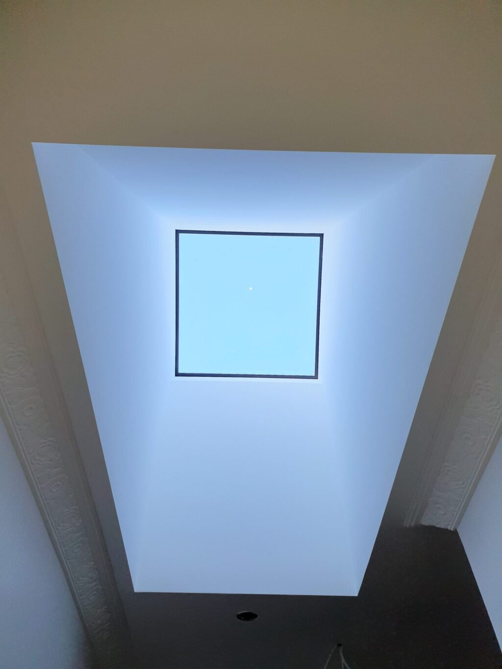 Skylight shaft with a square skylight.