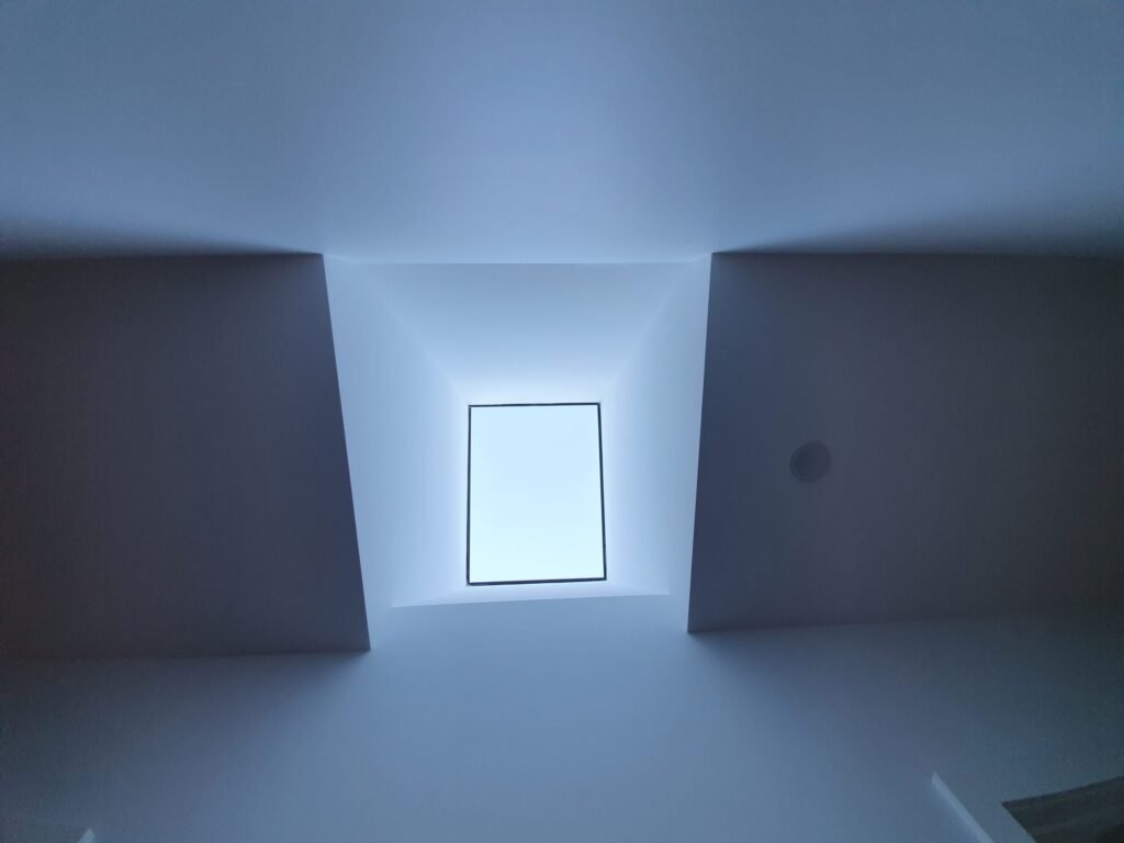 Hallway skylight with modern skylight shaft design.