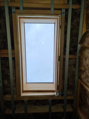 Skylight installation in an attic.